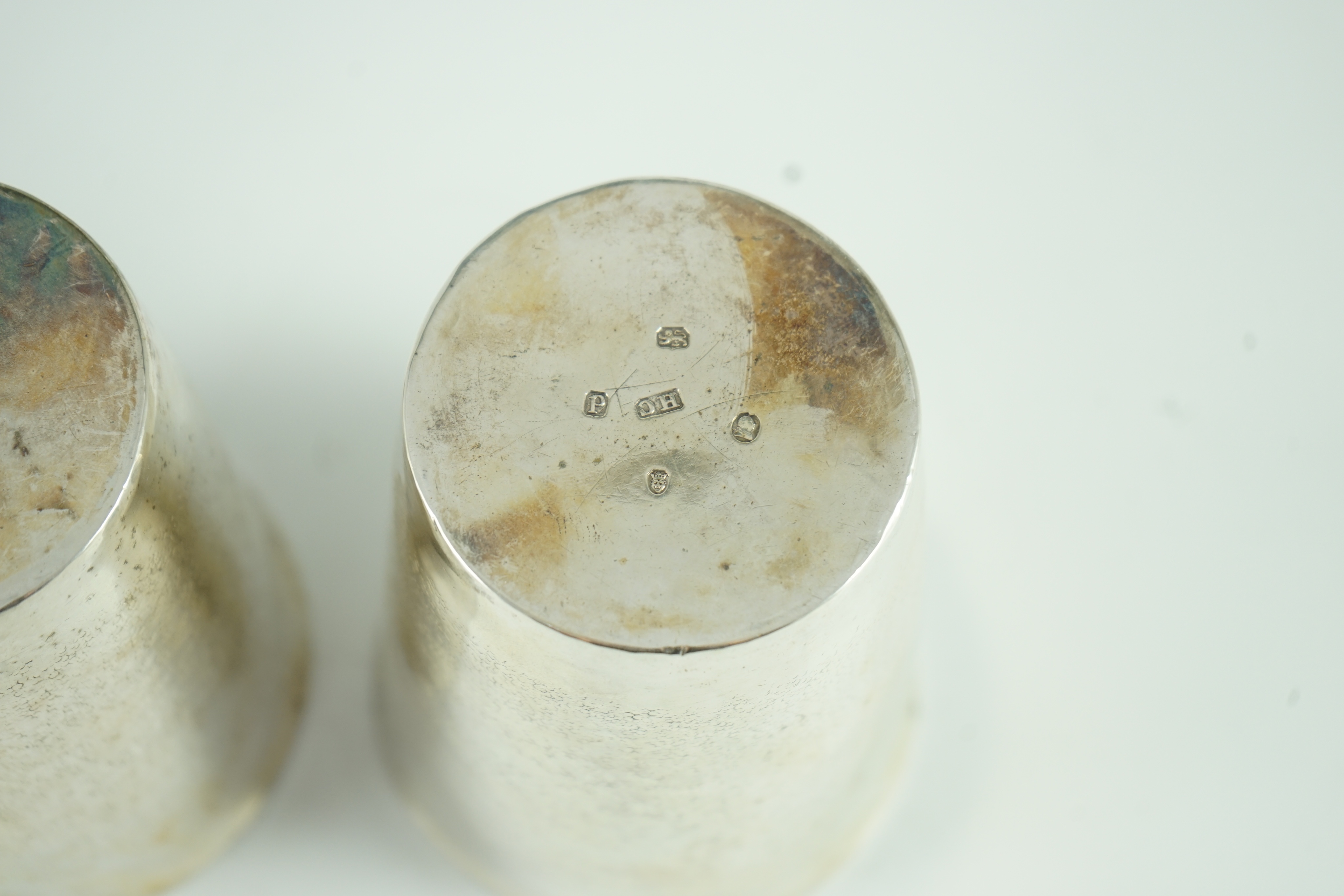 A pair of George III part textured silver beakers, by Henry Chawner